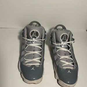 Gray & white Air Jordan’s with gray patent leather